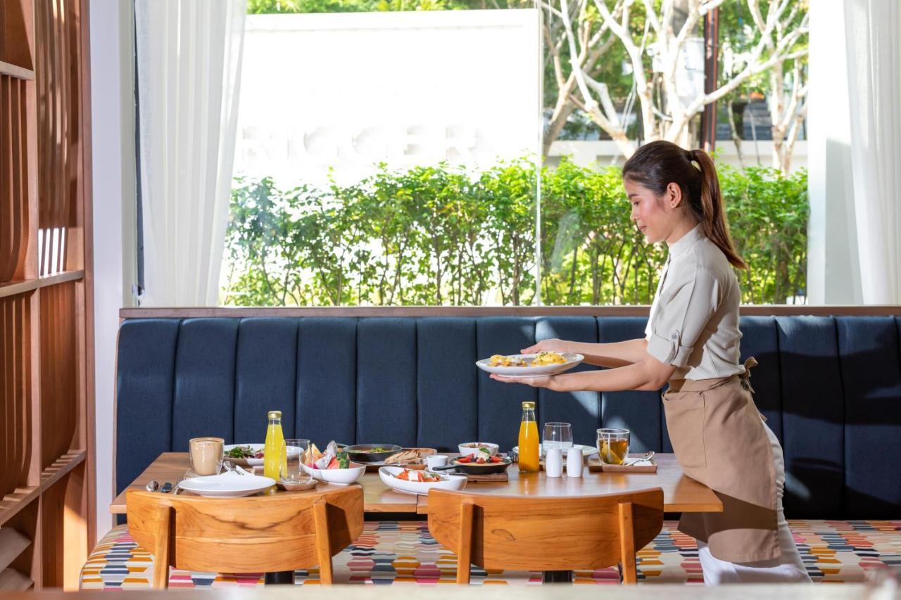 Outrigger Surin Beach Resort - Sha Extra Plus Εξωτερικό φωτογραφία A Thai waitress serving food