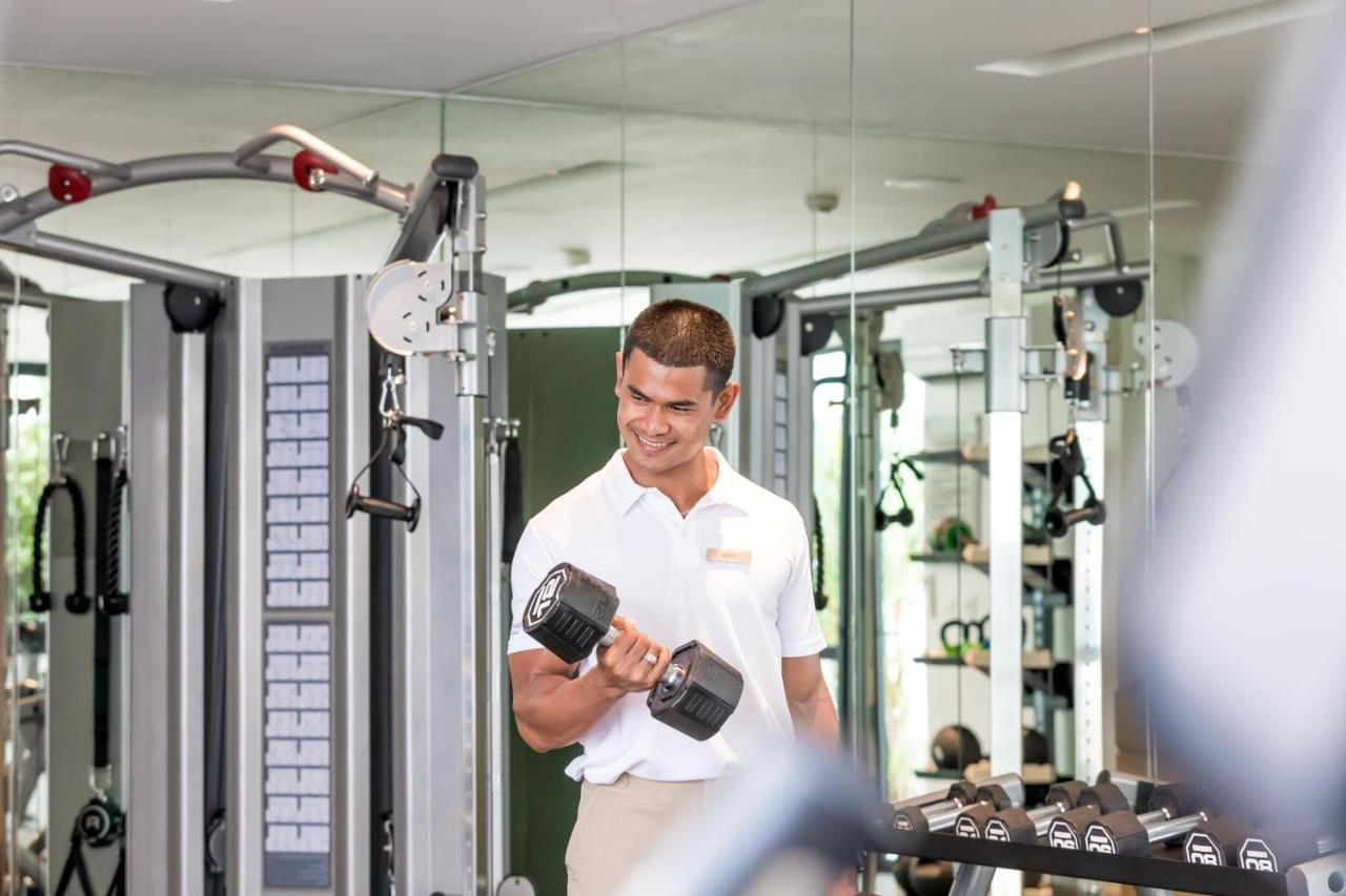 Outrigger Surin Beach Resort - Sha Extra Plus Εξωτερικό φωτογραφία A man lifting a dumbbell